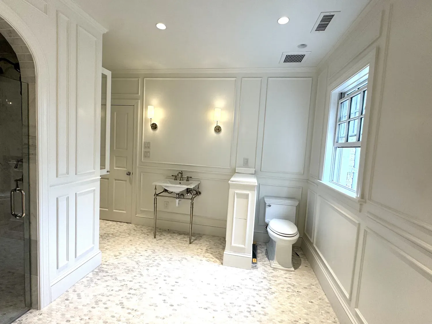 Bathroom remodel with wainscoting and tile by Building America Construction
