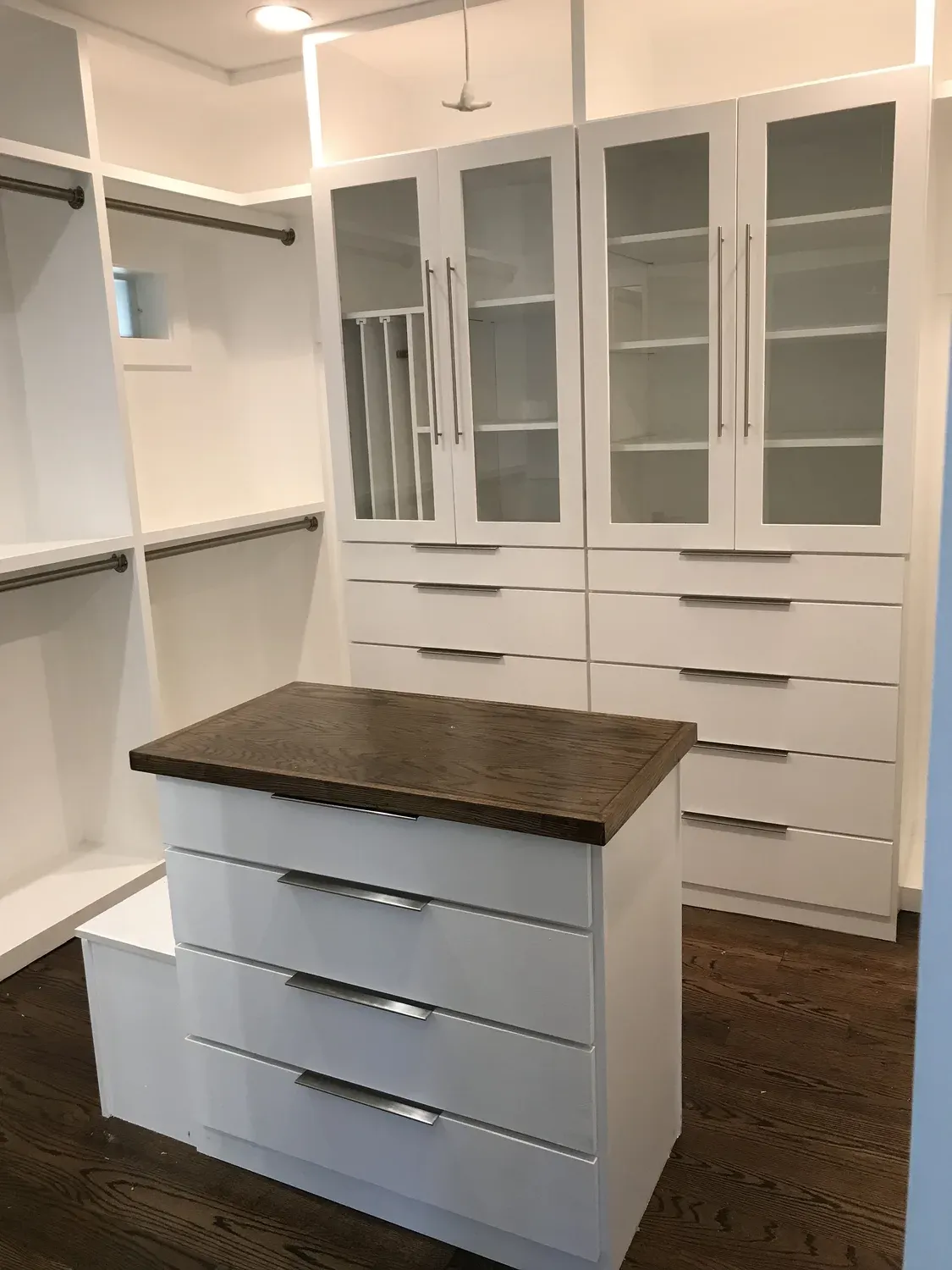 Custom cabinetry with butcher-block countertop by Building America Construction